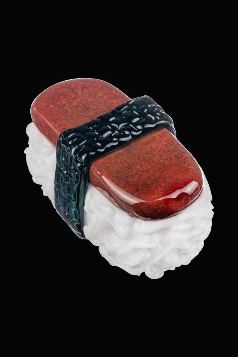 Front view of the Empire Glassworks Spam Musubi Sushi Hand Pipe, resembling a bite of sushi with a red and white color scheme.