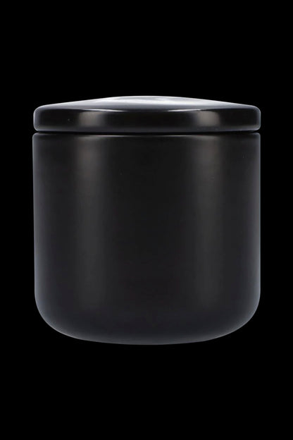 Black airtight cannabis storage jar.