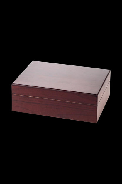 A slightly angled view of the Sigaro Personal Humidor Wood Box with Hygrometer, showing its polished wood finish and rectangular shape.