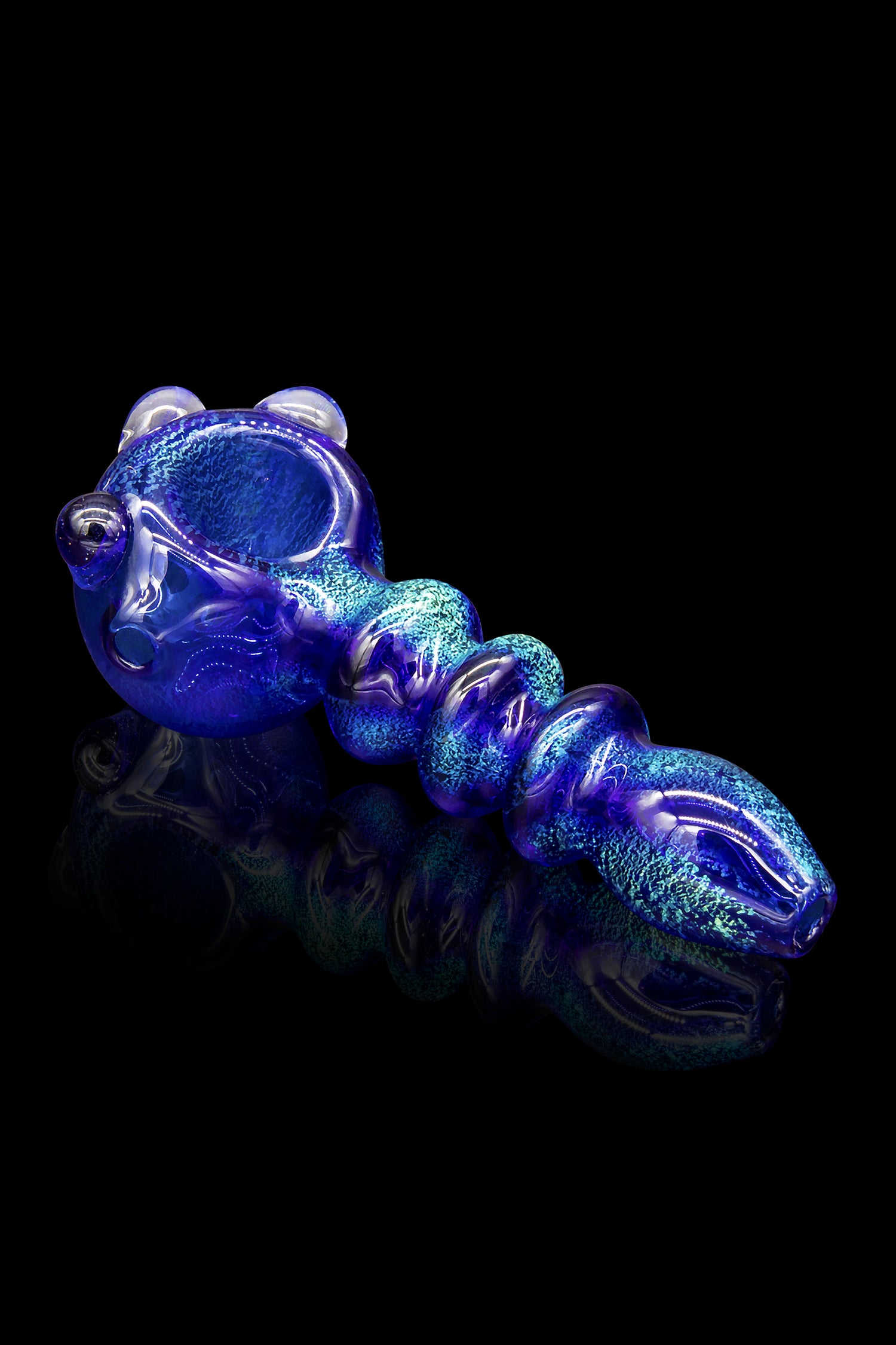 Blue glass cannabis pipe with speckled detailing on a reflective surface.