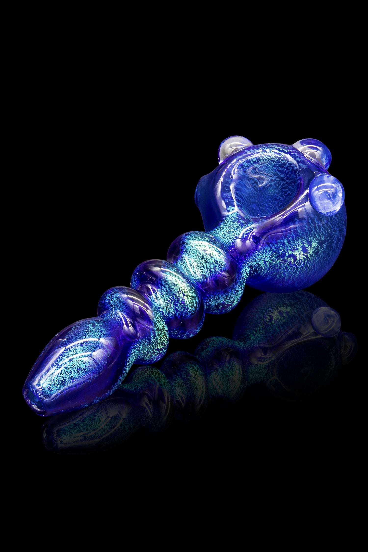 Blue glass pipe with intricate swirling patterns, isolated on a black background.