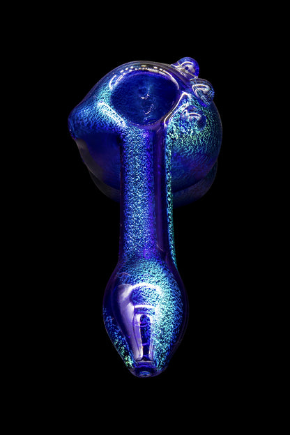 Blue glass pipe against a black background.