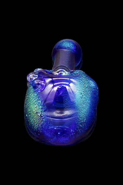 Blue glass water pipe with textured surface, studio shot.