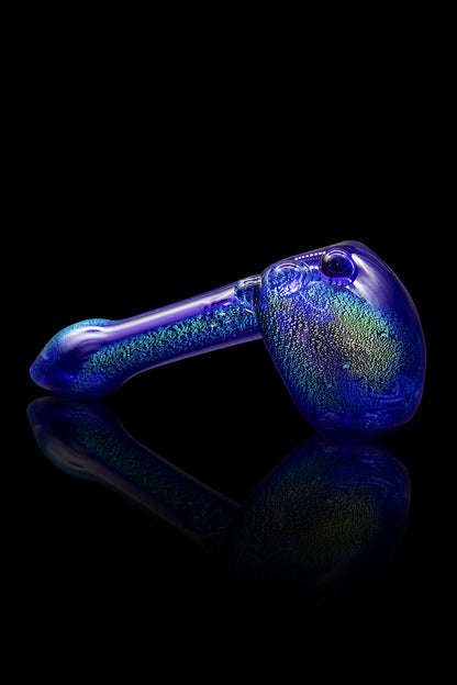 Blue glass pipe with textured surface and reflective base.