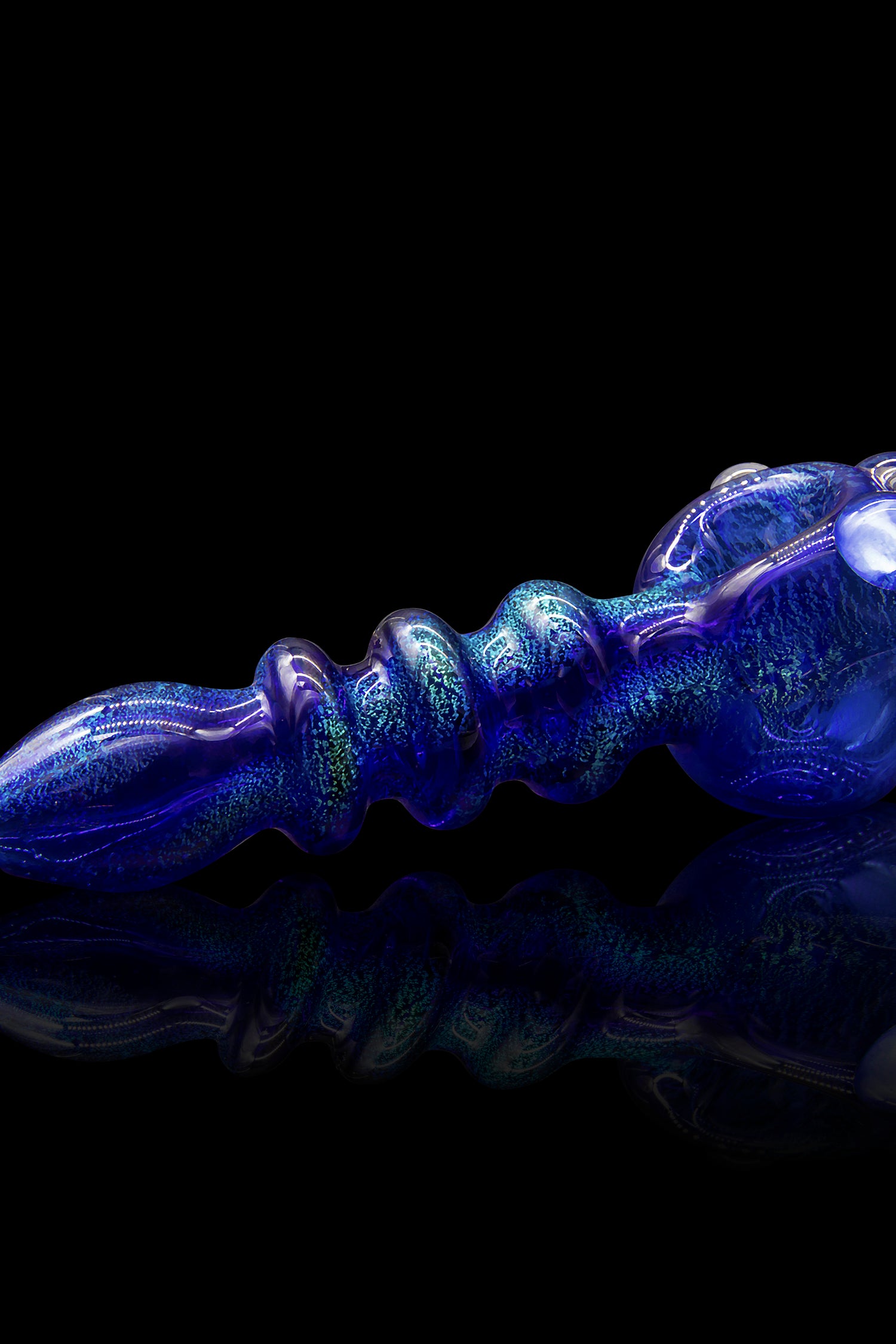 Blue glass cannabis pipe with textured surface and reflective sheen, displayed against a black background.