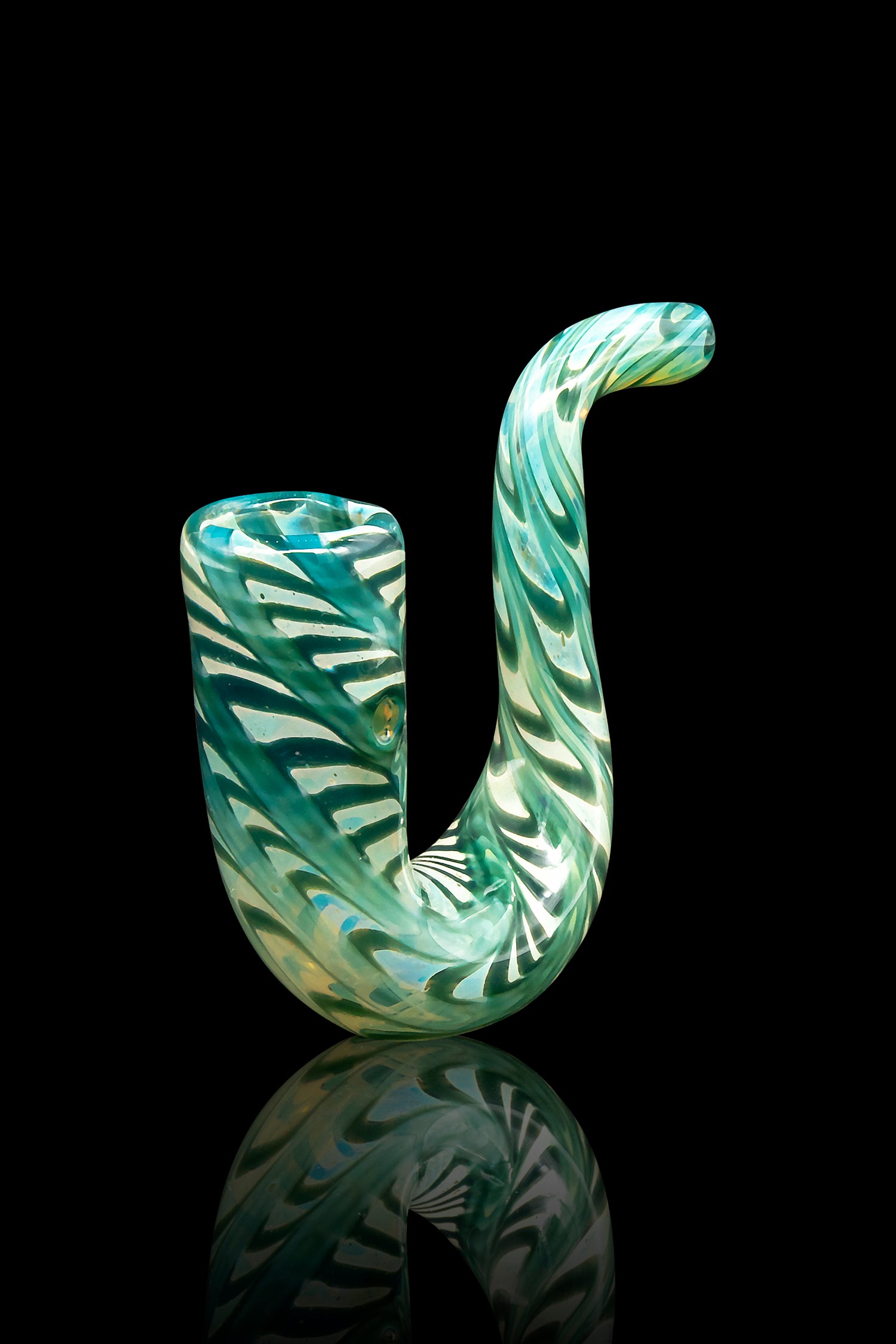 Green glass cannabis pipe with swirling patterns and a glossy finish, displayed against a black reflective surface.