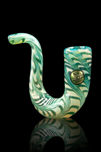 Green glass bubbler pipe with a serpentine shape, reflecting on a dark surface.