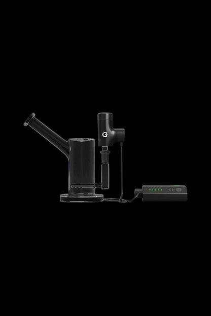 Black cannabis dab rig with electronic heating device and base, isolated on a black background.