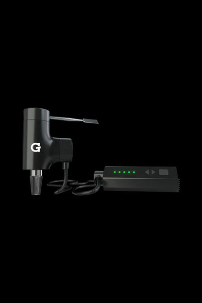 Black Grenco Science G Pen Elite vaporizer with charging dock.
