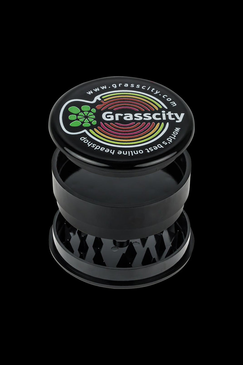 A close-up shot of the Grasscity Acrylic 3-Part Herb Grinder, showcasing its three-tiered design and metallic finish.
