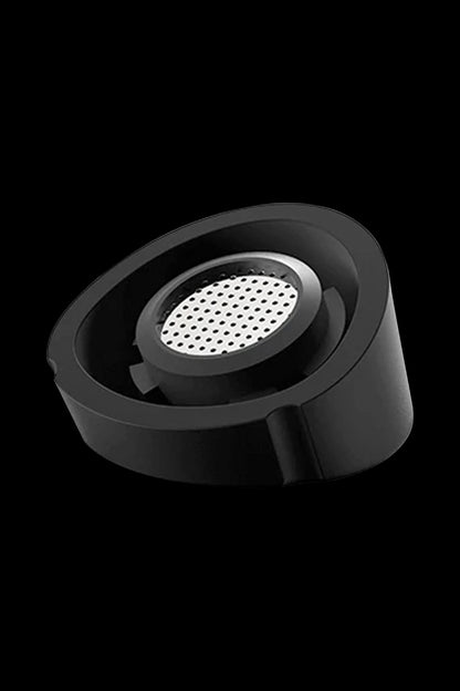 A close-up, angled view of the Pro Vaporizer, showcasing its circular design and dark, matte finish.