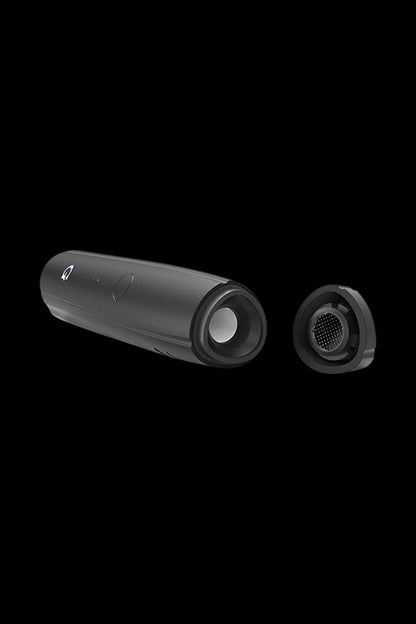 A side view of the Pro Vaporizer, showcasing its sleek, black cylindrical design alongside a detachable component on a dark background.