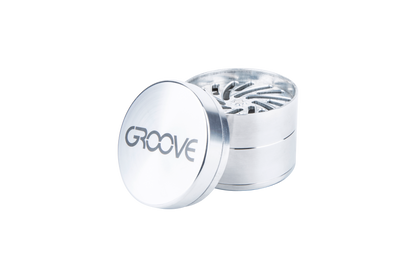 An open Aerospaced Groove 4-Piece Aluminum Grinders showing its four-part construction and metallic finish in a product shot.