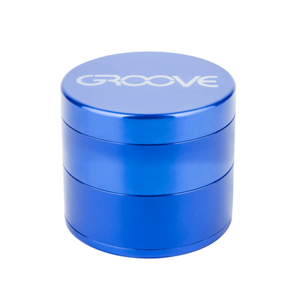 A studio shot of the Aerospaced Groove 4-Piece Aluminum Grinders, showcasing the four-tiered cylindrical design in a metallic blue finish.