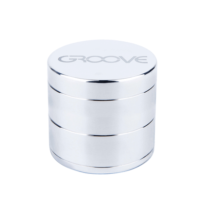A studio shot of the Aerospaced Groove 4-Piece Aluminum Grinders, showcasing its stacked, cylindrical design in polished metal.