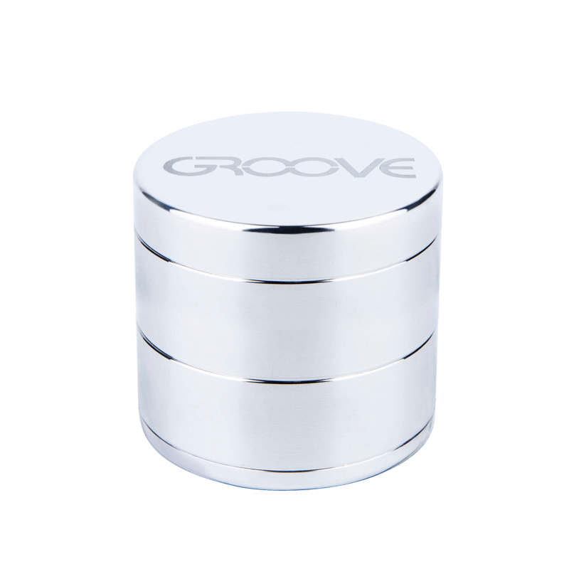 A studio shot of the Aerospaced Groove 4-Piece Aluminum Grinders, showcasing its stacked, cylindrical design in polished metal.