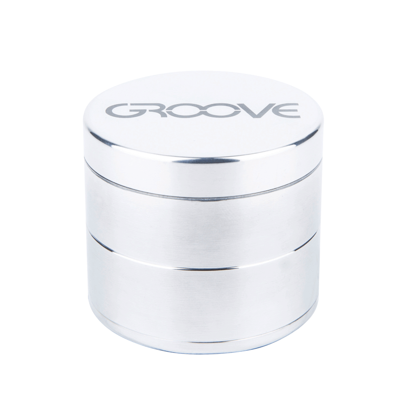 A close-up, angled view of the Aerospaced Groove 4-Piece Aluminum Grinders, showcasing its metallic finish and cylindrical shape.