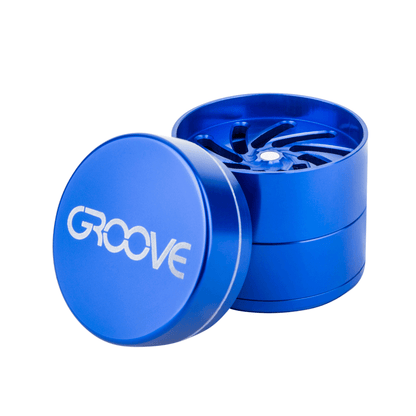 An open Aerospaced Groove 4-Piece Aluminum Grinders showing the tiered, metallic grinding teeth inside the silver-toned casing.