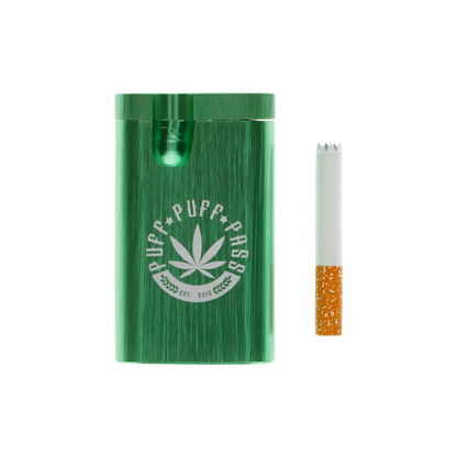 A close-up of the Aluminum Dugout, showing a partially smoked joint extending from its green metallic casing.