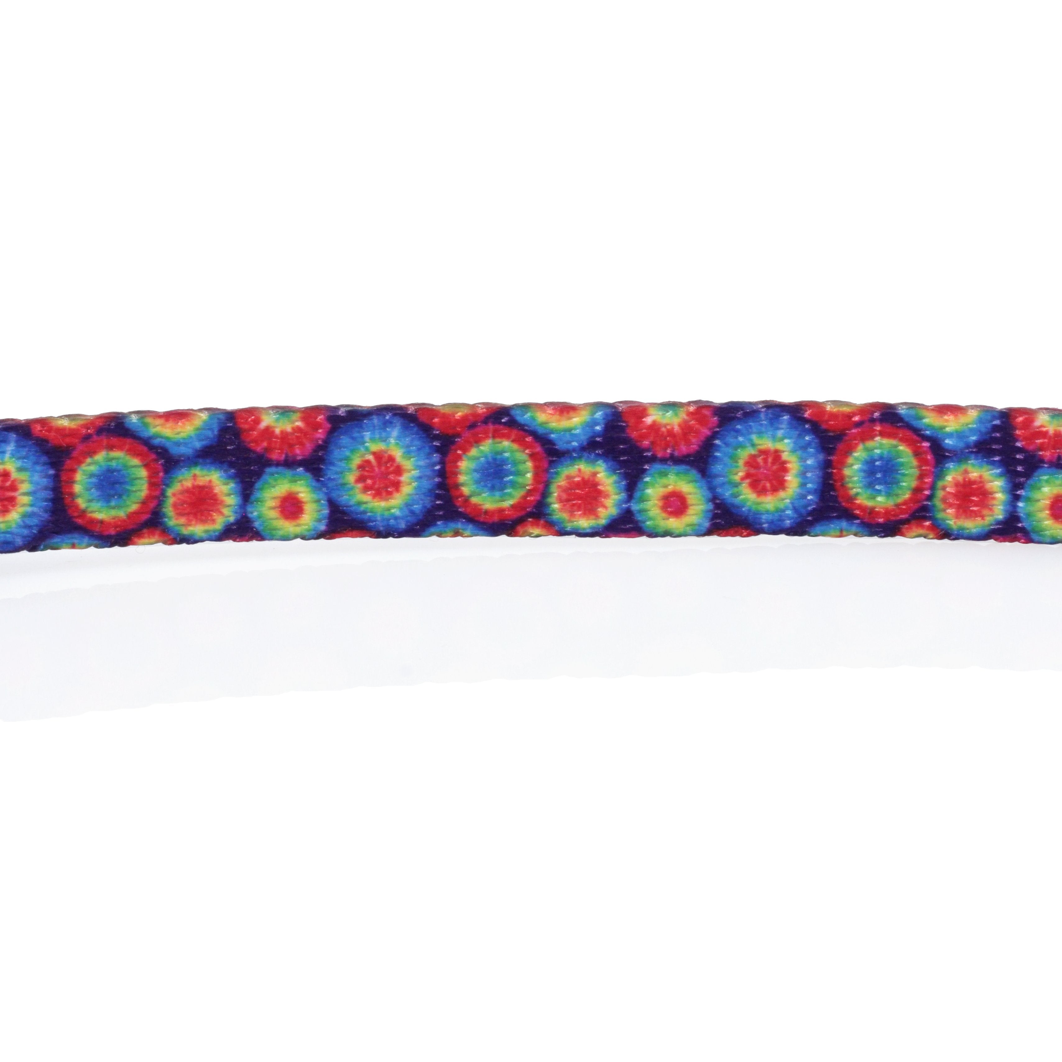 A close-up, top-down view of the HeadyPet Cat Collar, showcasing its vibrant, patterned design.