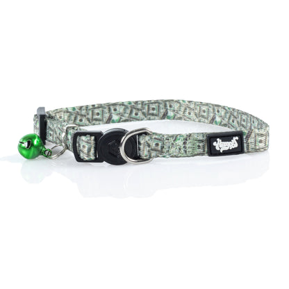 A close-up side view of the HeadyPet Cat Collar, featuring a patterned fabric strap and a silver buckle with an attached bell.