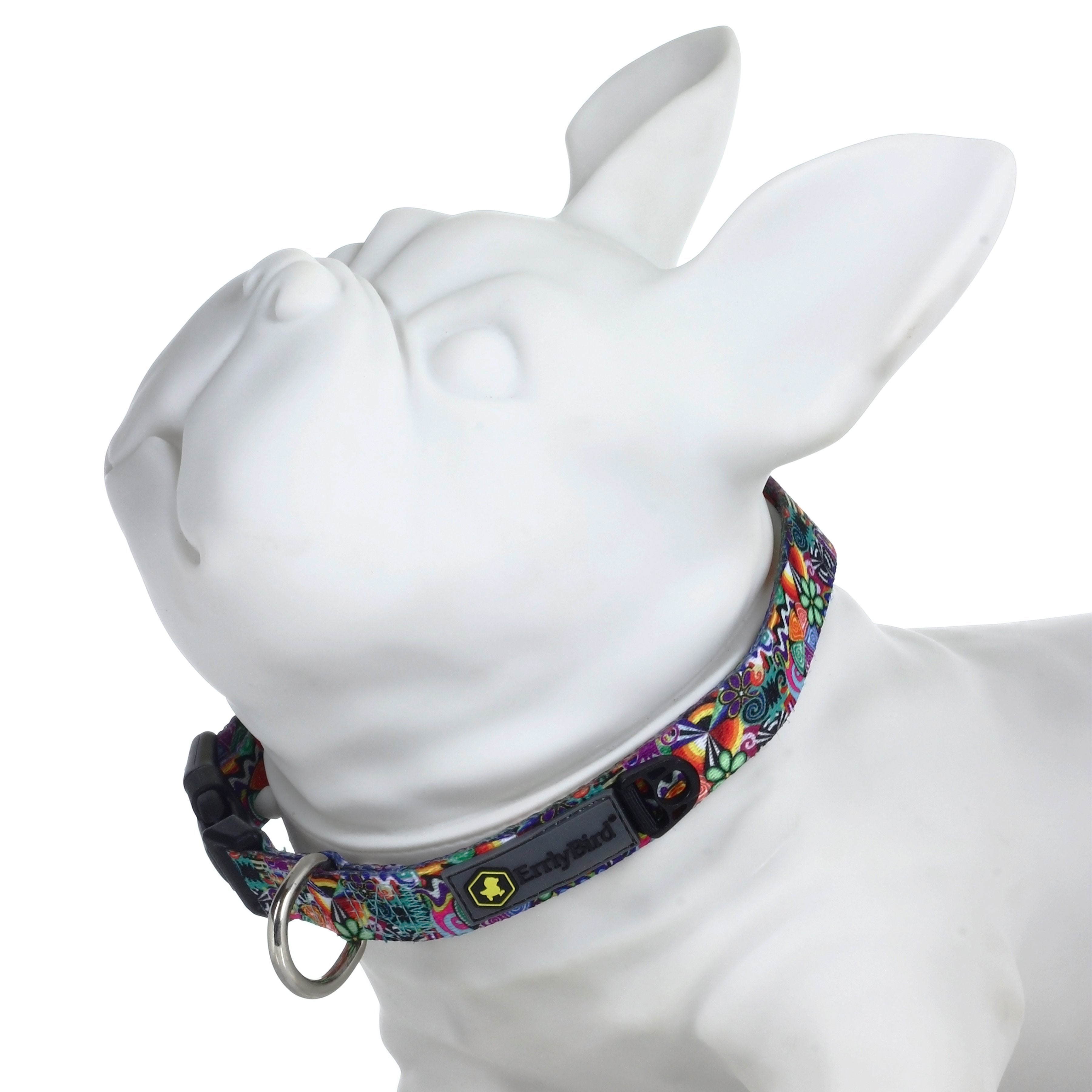 A close-up, angled view showcases the HeadyPet OG Collar, patterned with vibrant colors against a plain white background.