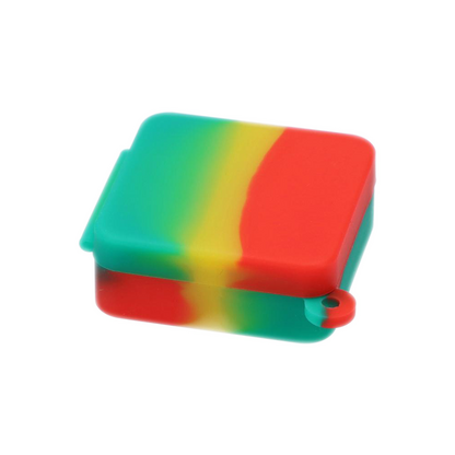 Three-quarter view of a red, yellow, and green silicone square Keychain Stash Container showing the hinged lid and small keyring loop.