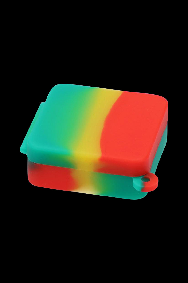 Front-facing view of a rainbow-striped Silicone Square Keychain Stash Container on a black background, showing its hinged lid and small attachment loop.