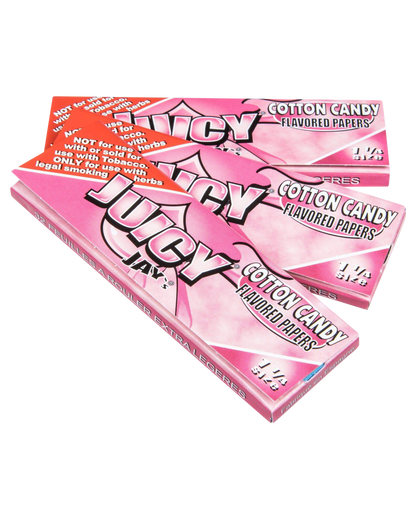 A close-up of Juicy Jay's Classic Size Flavored Rolling Papers package with bold lettering against a vibrant, patterned backdrop.
