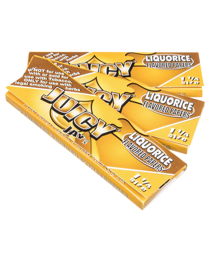 A close-up, angled shot of Juicy Jay's Classic Size Flavored Rolling Papers, displaying vibrant branding and colorful designs.