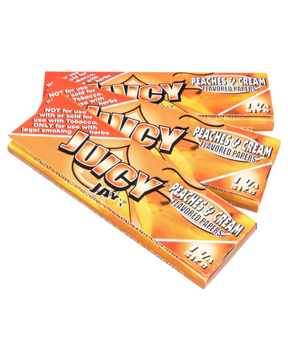 Close-up of Juicy Jay's Classic Size Flavored Rolling Papers, stacked and displaying peach-themed artwork.