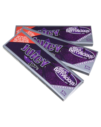 Close-up of a package of Juicy Jay's Superfine 1-1/4" Flavored Rolling Papers with vibrant colorful design and text.