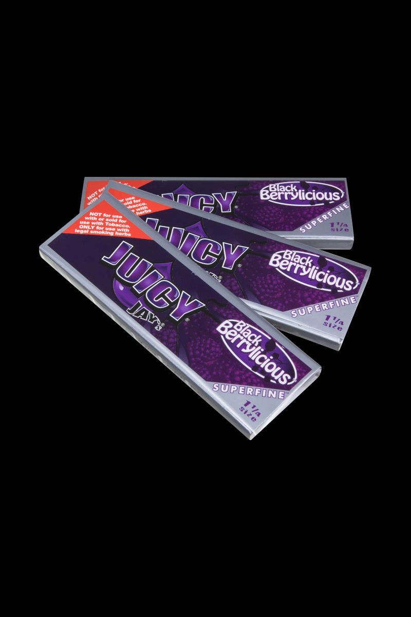 Front view of Juicy Jay's Superfine 1-1/4" flavored rolling papers, stacked and displaying colorful patterned designs.