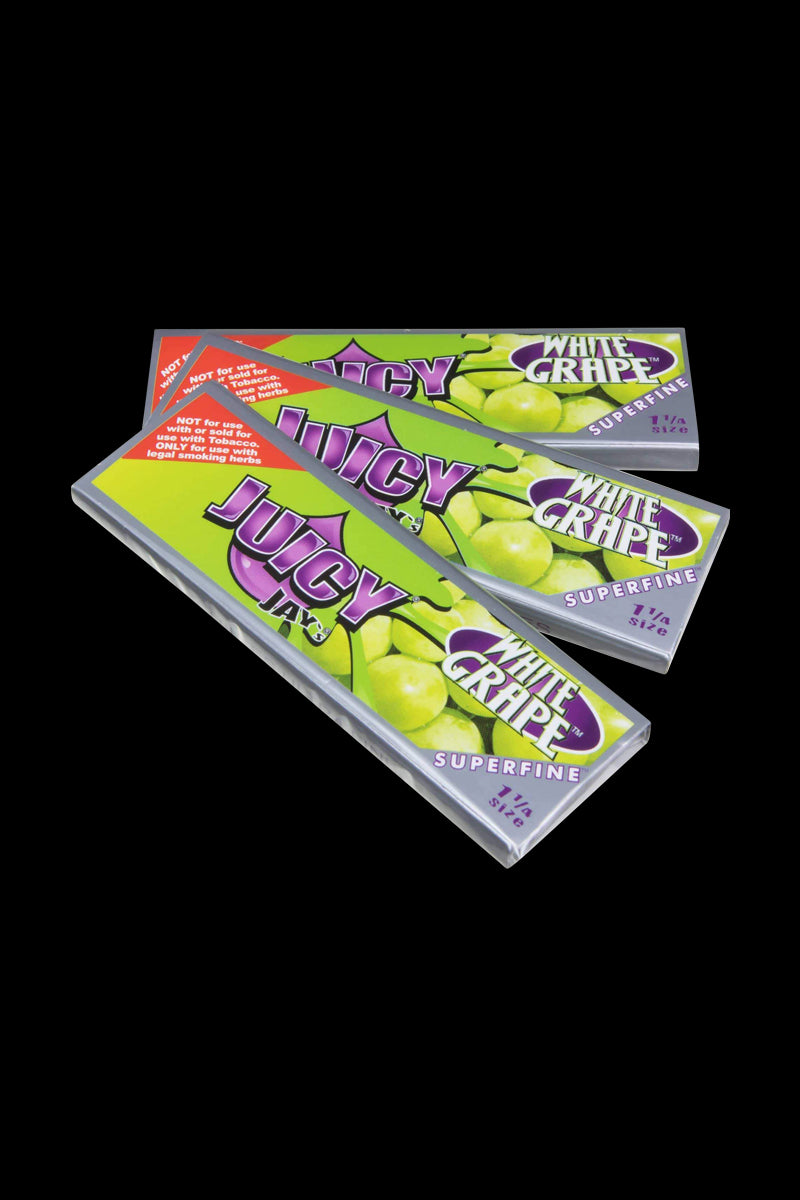 A stack of Juicy Jay's Superfine 1-1/4" flavored rolling papers, shown from a slight angle with branding visible on the packaging.
