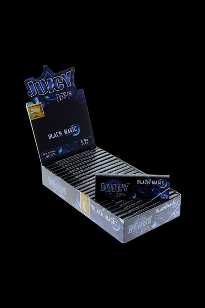 A close-up of the Juicy Jay's 1 1/4 Black Magic Rolling Papers package, angled slightly to showcase the branding and black color scheme.