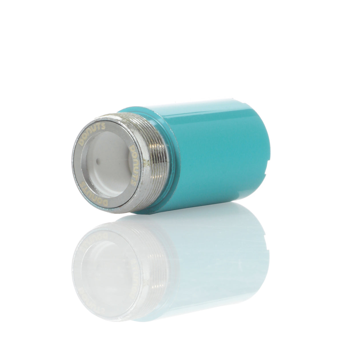 A studio shot of the Kandy Pens Donut Replacement Coil, reflecting in a mirrored surface below.