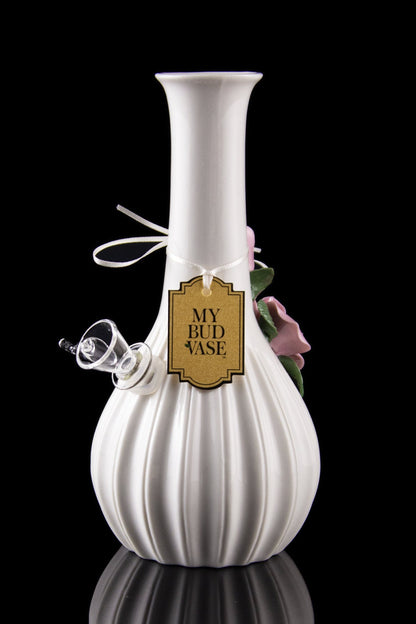Elegant white glass water pipe with floral accents and a label reading "My Bud Vase," displayed against a black background.