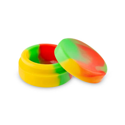 Colorful silicone concentrate container with lid open beside it.