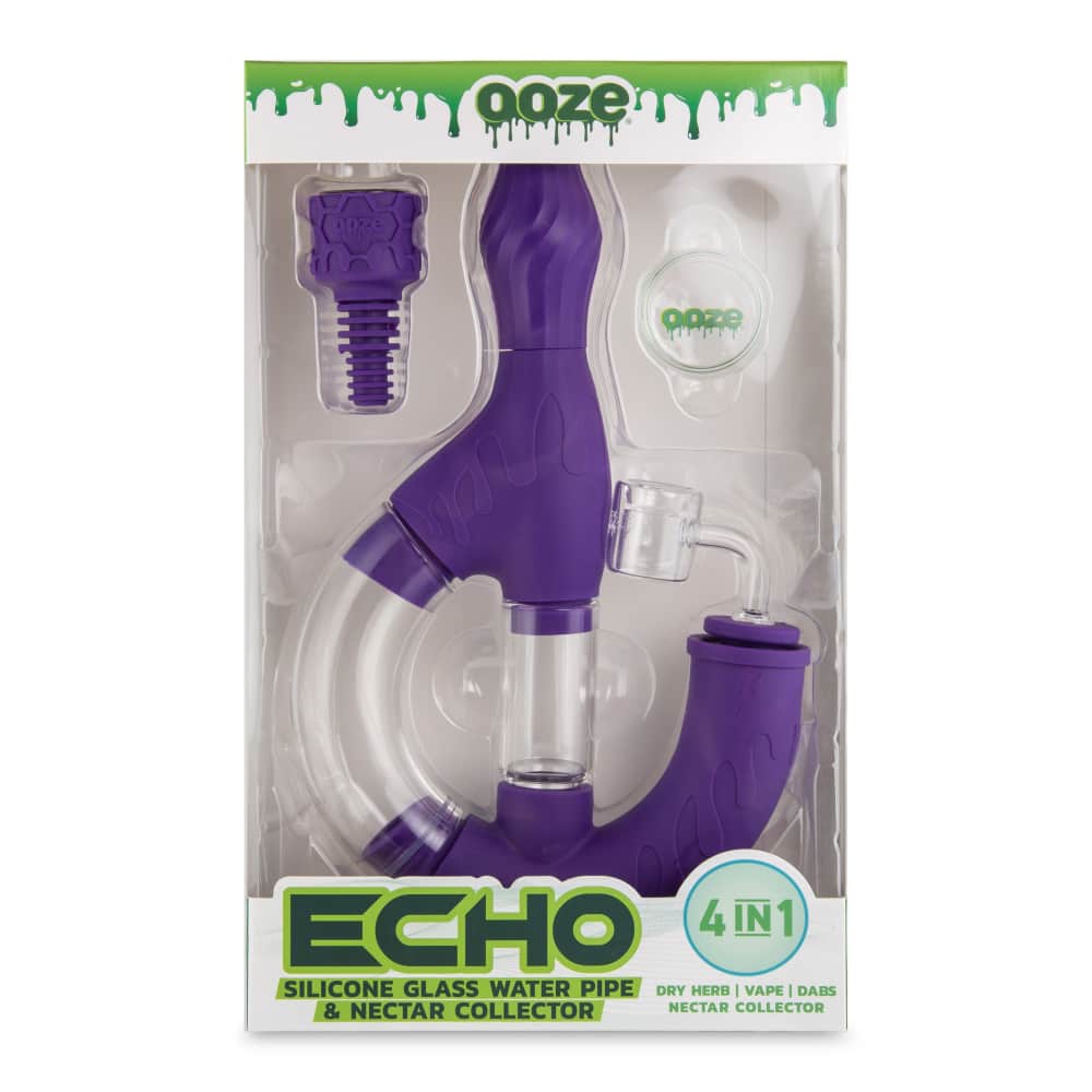 Purple silicone glass water pipe and nectar collector with accessories in retail packaging.