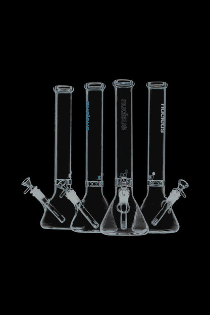 A front view of the Nucleus 12" Beaker Bong with Donut Style Ice Catcher, showing a clear glass piece against a black backdrop.