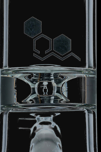 Front view of the Nucleus 12" Beaker Bong with Donut Style Ice Catcher, showing its clear glass construction and cylindrical shape.