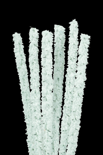 A close-up shot of vibrant, flexible Nucleus Barbed Pipe Cleaners arranged in a slightly messy, colorful pile.