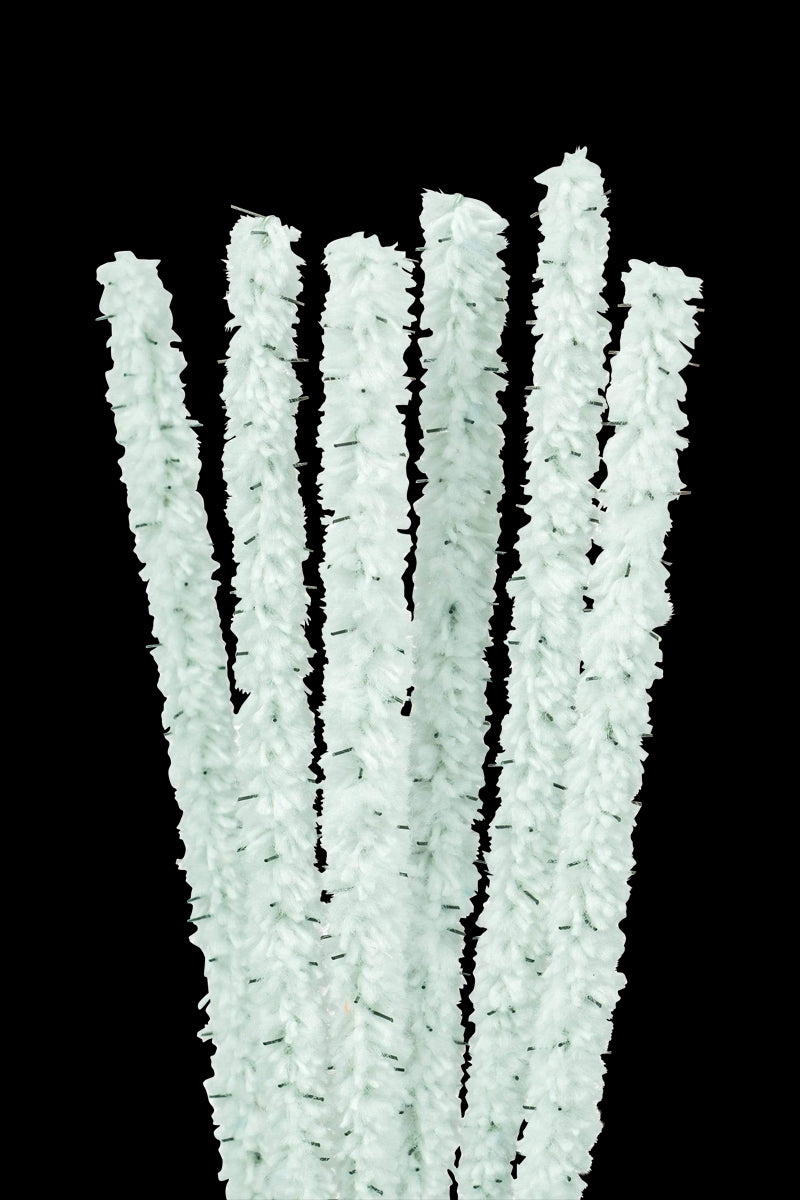 A close-up shot of vibrant, flexible Nucleus Barbed Pipe Cleaners arranged in a slightly messy, colorful pile.