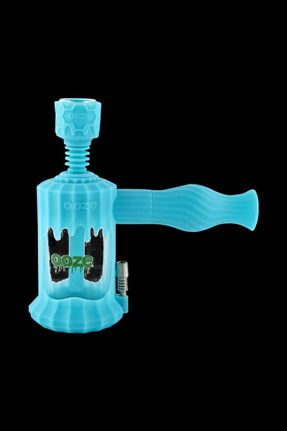 A bright blue Clobb 4 in 1 Silicone Pipe is shown in a studio shot with a slight upward angle, highlighting its smooth, curved design.