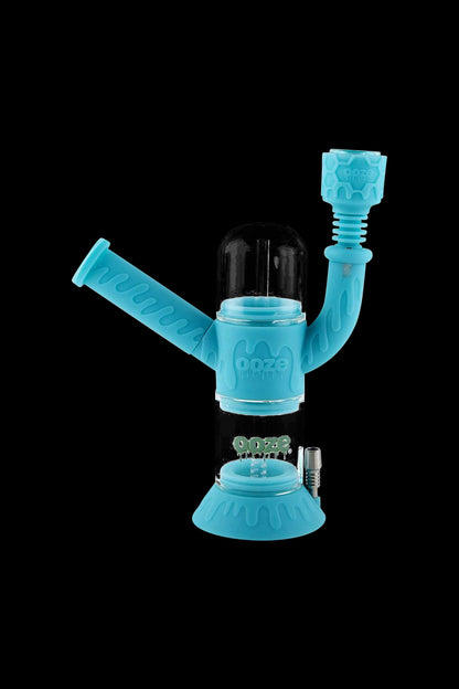Front view of the Ooze "Cranium" Silicone 4-in-1 Glass Water Pipe, showcasing its unique sculpted design and clear glass construction.
