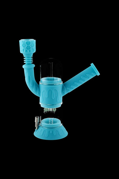 A front view of the Ooze "Cranium" Silicone 4-in-1 Glass Water Pipe, showcasing its colorful, sculpted design against a black background.