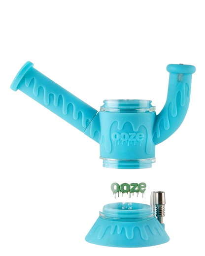 A front view of the Ooze "Cranium" Silicone 4-in-1 Glass Water Pipe, featuring a vibrant blue and clear glass design.