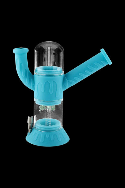 A front view of the Ooze "Cranium" Silicone 4-in-1 Glass Water Pipe, displaying a blue glass bulb with a curved neck.
