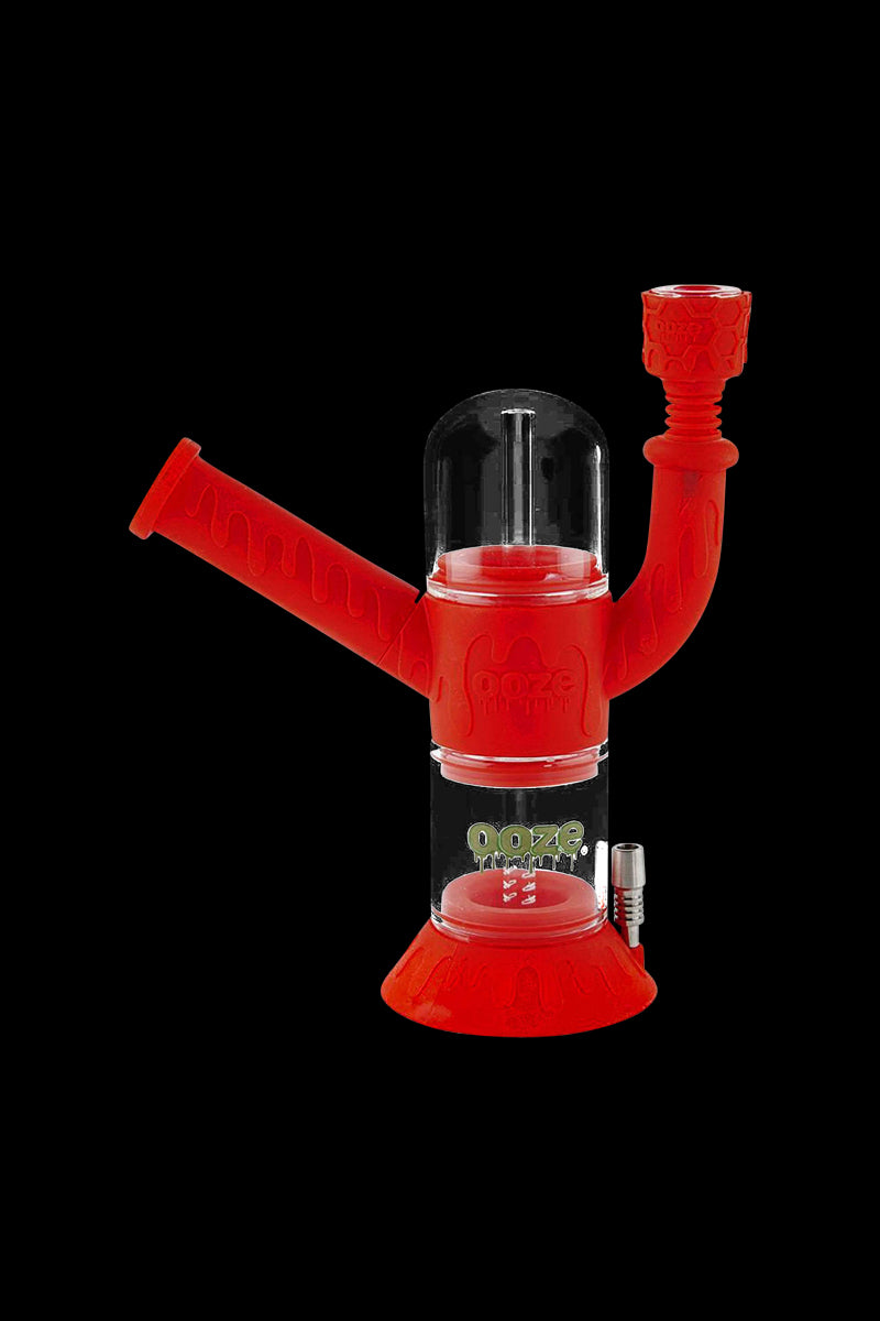 Front view of the Ooze "Cranium" Silicone 4-in-1 Glass Water Pipe, showcasing its red glass construction and unique skull-shaped design.