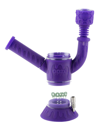 Front view of the Ooze “Cranium” Silicone 4-in-1 Glass Water Pipe, showing the purple silicone wrapped around clear glass.